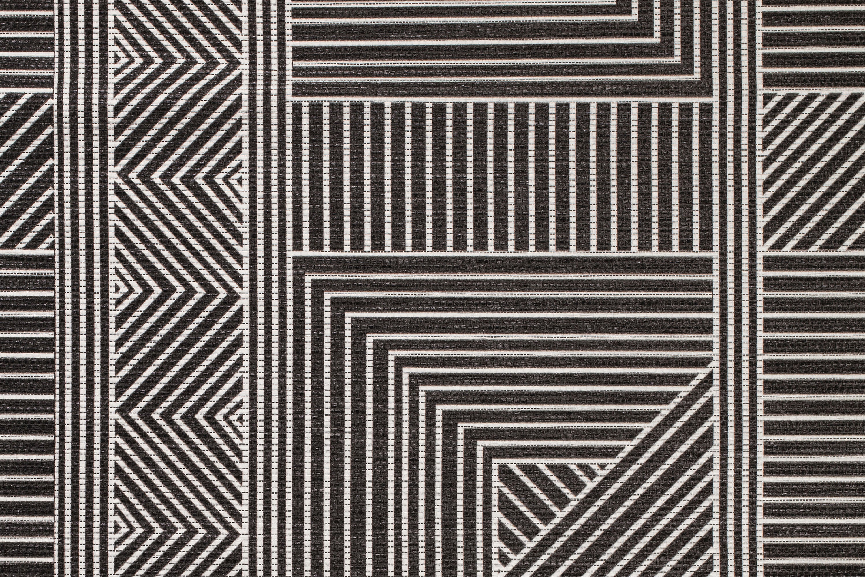 Geometric pattern of black and white stripes on a textured surface for window shades