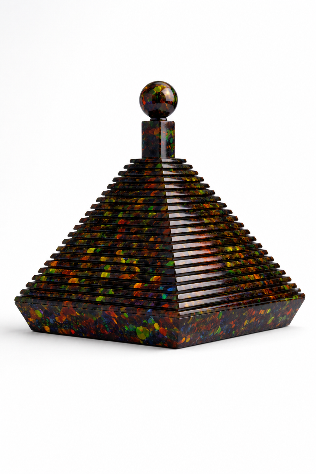 Multicolored pyramid-shaped stepped architectural object on a white background