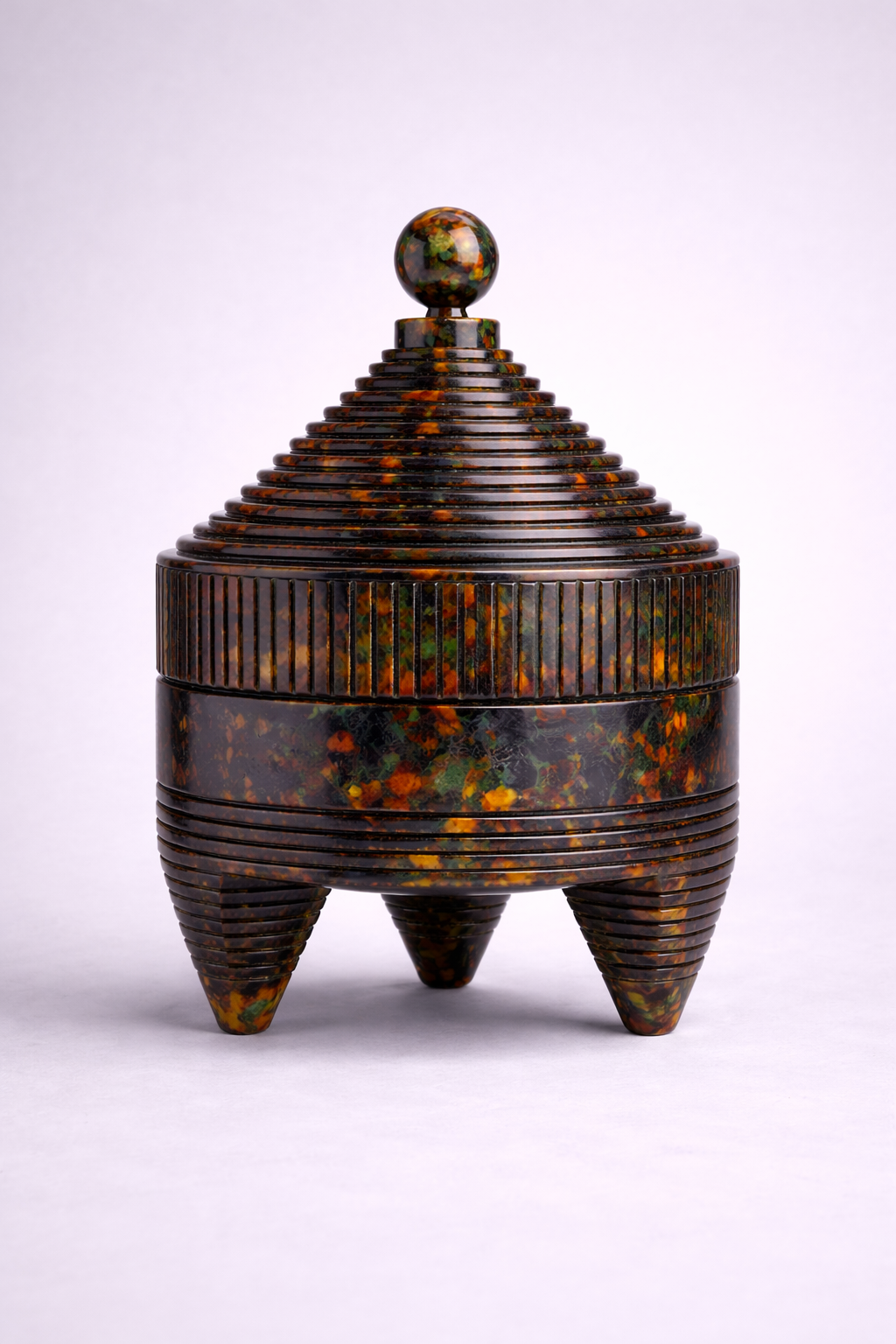 Decorative container object with a ribbed design and opal multicolored pattern on a white background