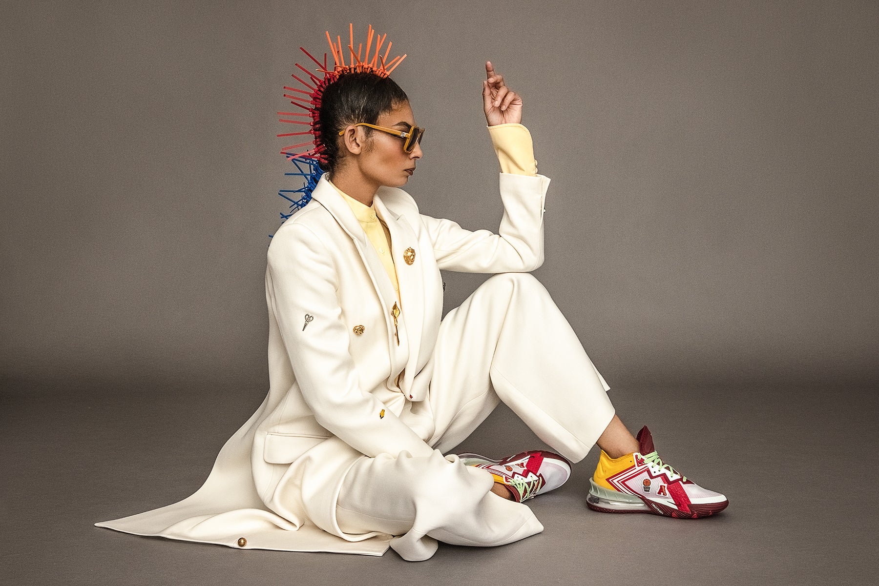 LeBron 18 Low x Mimi Plange Higher Learning, model with mohawk in white suit by fashion designer suiting