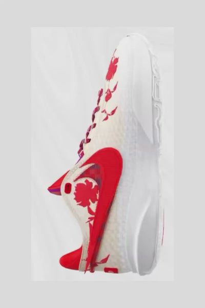 Video of an Ivory and White shoe with red florals and multi colored shoe laces and red swoosh.